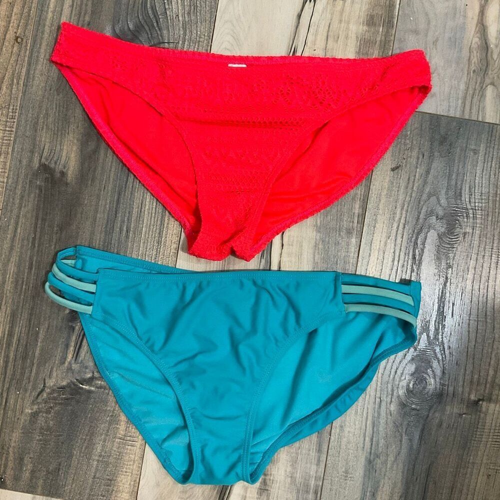 Two pairs of women’s swim bottoms size large, blue and orange
